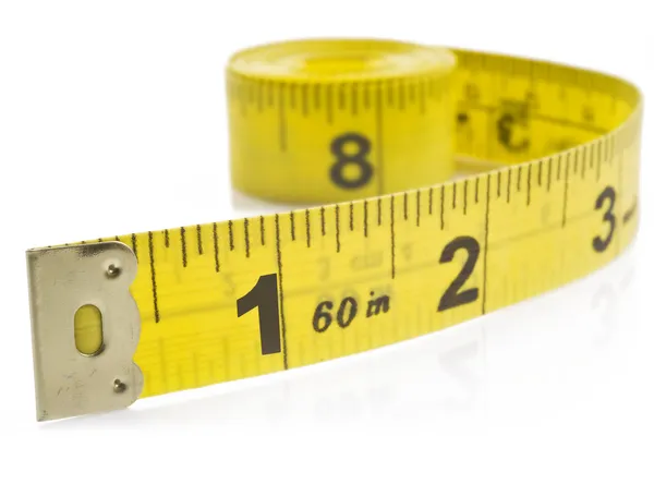 Yellow tape measure on rolled up on white background Stock Photo