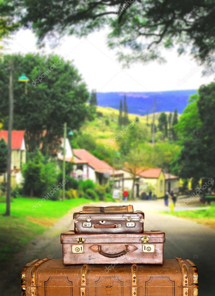 Traveling suitcases in a small town street