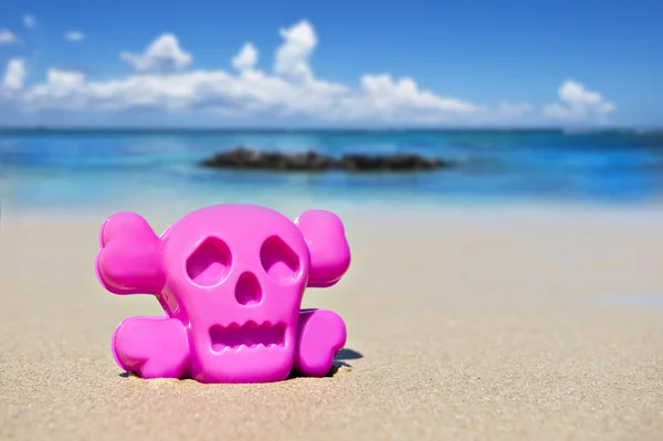 stock image Pink toy on the beach showing danger