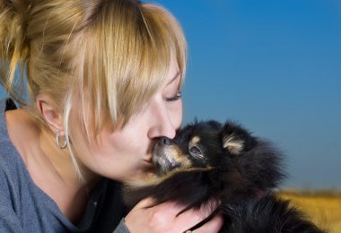 Beautiful woman with a small spitz clipart