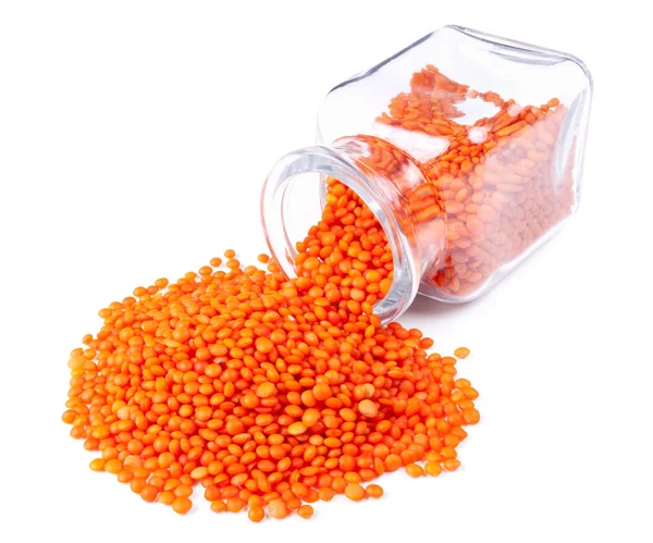 Red lentils scattered on a white background — Stock Photo, Image