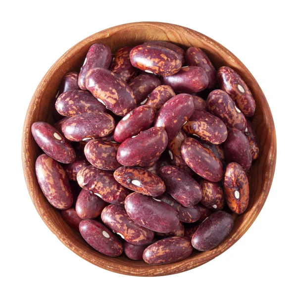 Wooden bowl full of red speckled kidney beans isolated on white — Stok Foto