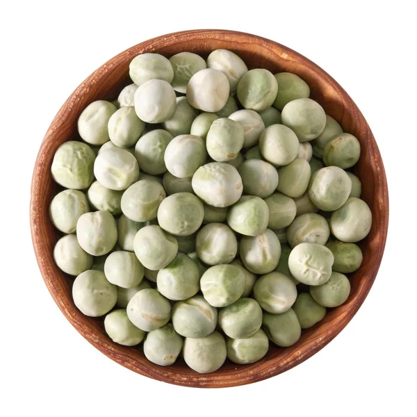Wooden bowl full of green peas isolated on white — Stok Foto