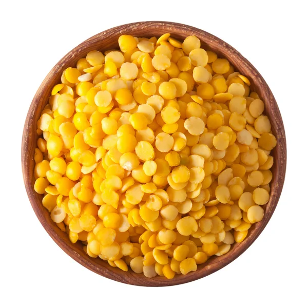 Wooden bowl full of yellow split lentils isolated on white — Stock Photo, Image