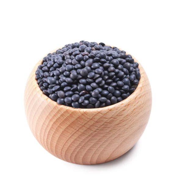 stock image Wooden bowl full of beluga lentils isolated on white