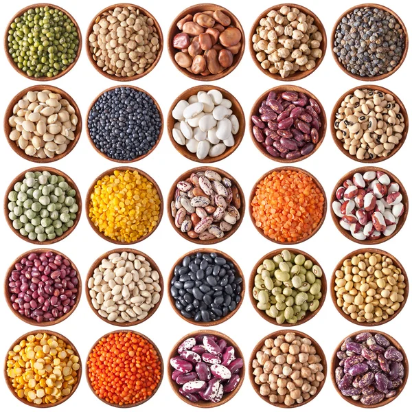 Collection of wooden bowls with legumes — Stock Photo, Image