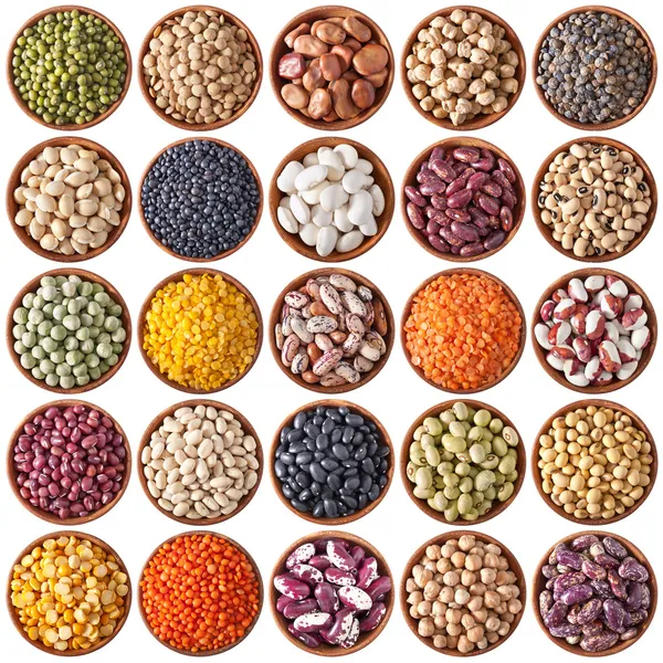 Collection of wooden bowls with legumes Stock Photo