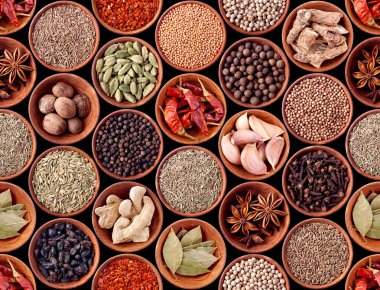 Seamless texture of spices on black clipart