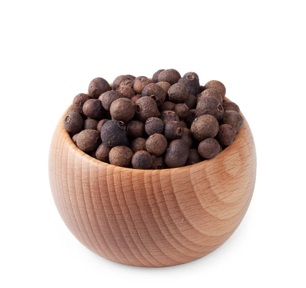 Wooden bowl full of pimento isolated on white — Stock Photo, Image