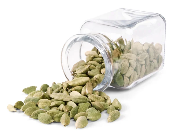 Cardamom is scattered on a white background — Stock Photo, Image