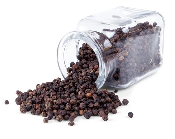 Black pepper is scattered on a white background — Stock Photo, Image