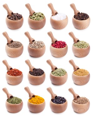 Collection of wooden bowls full of different spices clipart