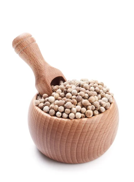 Wooden scoop in bowl full of white peppercorn — Stock Photo, Image