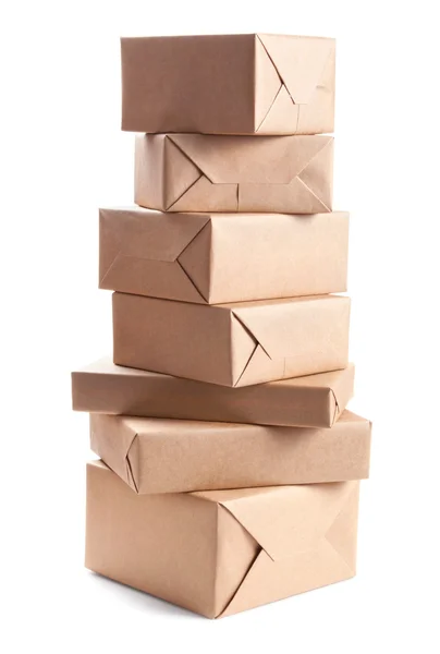 Stack of parcel wrapped with brown packing paper — Stok Foto