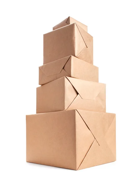 Stack of parcel wrapped with brown packing paper — Stock Photo, Image