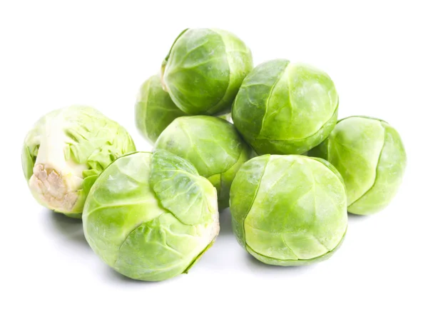 Fresh green Brussels sprouts isolated on white Stock Photo