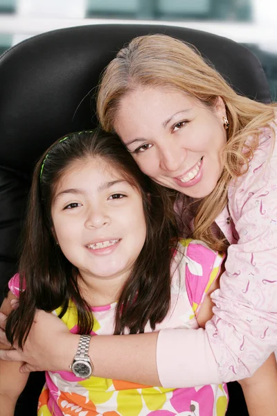Close up of affectionate mother and daughter at home — Stock Photo, Image