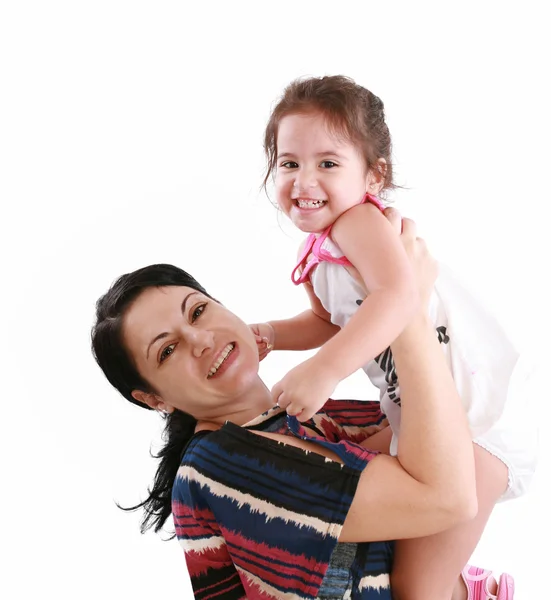 Little girl hugging to mother, in her arms — Stock Photo, Image