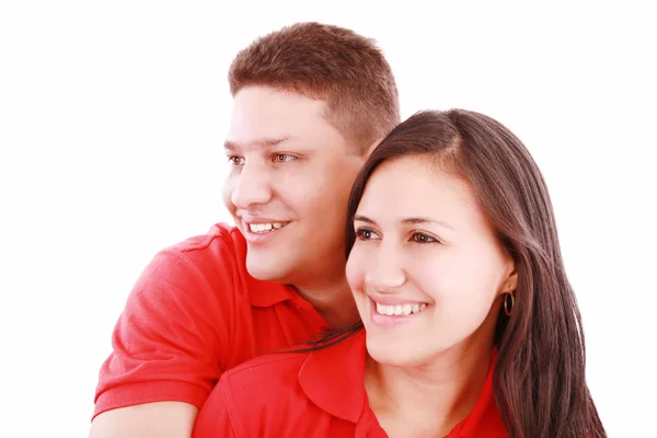 Heureux jeune couple souriant regardant loin, isolé sur blanc — Photo