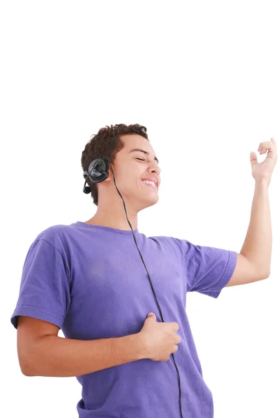 Smiling young man listen music with headphones — Stock Photo, Image