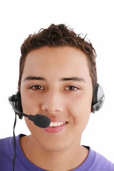 Uśmiechający się młody człowiek z słuchawki telefon na białym tle na biały backg — Zdjęcie stockowe