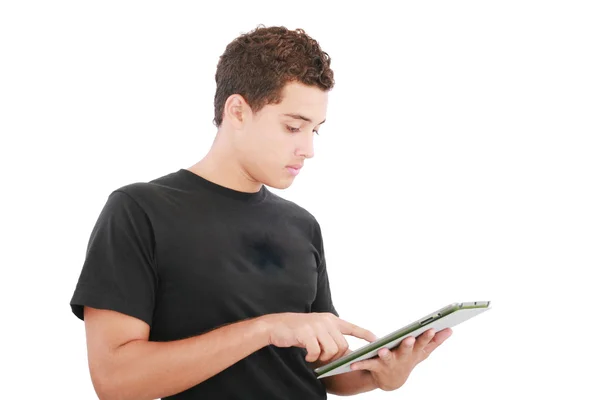 Молодой случайный студент работает над цифровым планшетом. Isolated on a — стоковое фото
