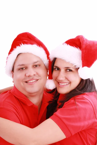 Jovem casal feliz perto com chapéus de Papai Noel. Isolado sobre o bac branco — Fotografia de Stock