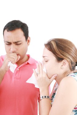 Young couple having the flu, isolated over white background clipart