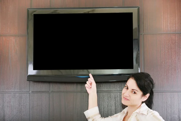Businesswoman presentation with lcd tv — Stock Photo, Image