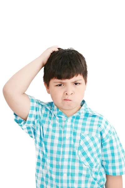 Boy scratches his head in puzzlement or confusion, as if ponderi — Stock Photo, Image