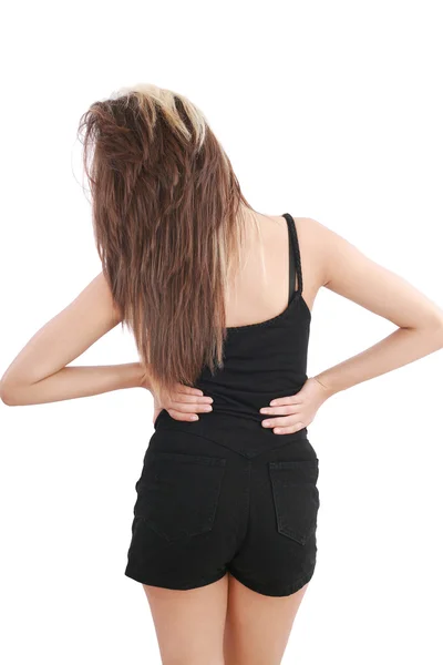 Fechar-se de mulher jovem que sofre de dor nas costas — Fotografia de Stock