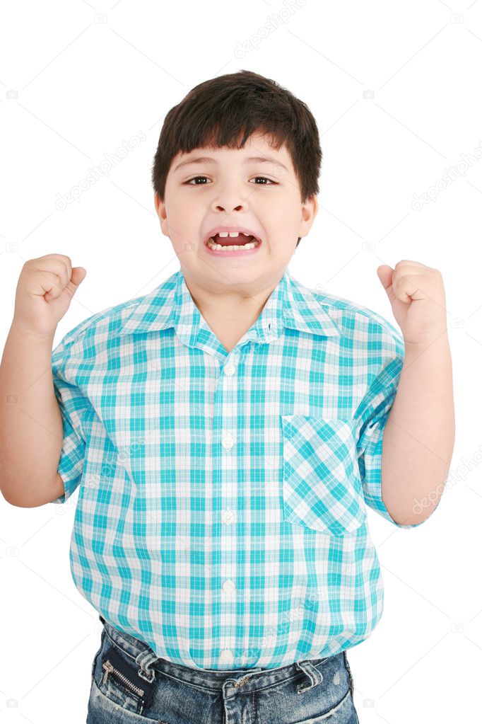 Portrait of a eigth year old boy clenching his fists and screami