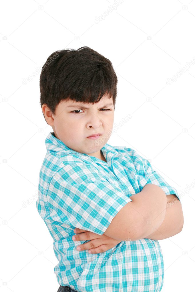 Serious little boy with hands folded standing isolated on white