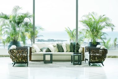 Sofas overlooking sea in Playa Bonita, Panama. clipart