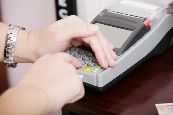 stock image Human hand enter atm banking cash machine pin code