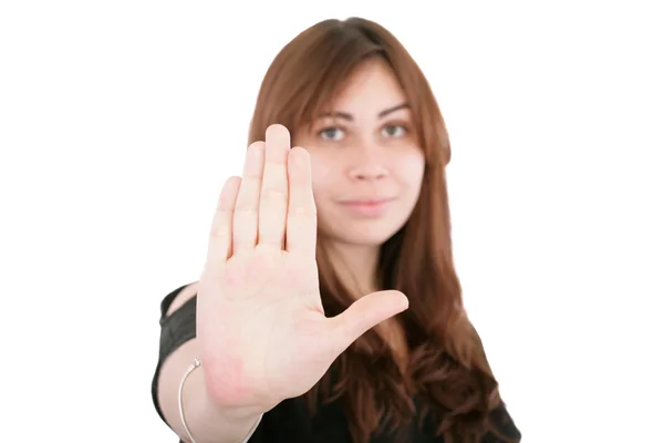Mladá žena při zastavení s rukou na bílém pozadí — Stock fotografie