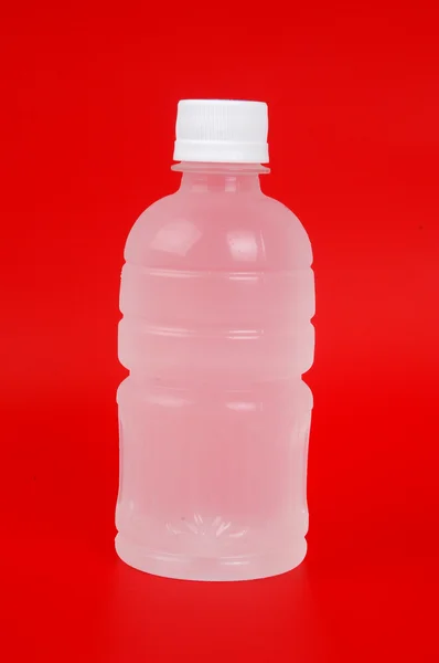 Küçük yeşil bir plastik şişe — Stok fotoğraf