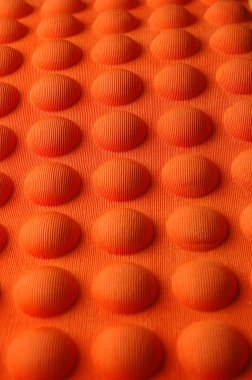 Detailed pattern of orange and brown seat cushion clipart