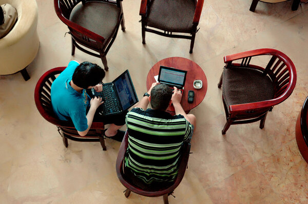 Two men were chatting in a hotel lobby
