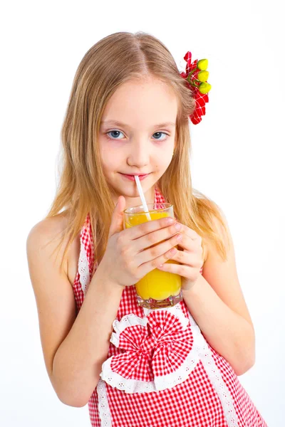 Portrait of little girl drinking orange juice — Stock Photo, Image