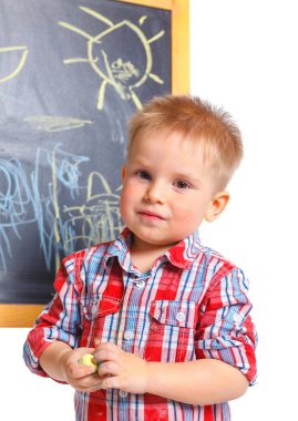 Little boy draws on the board clipart