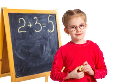 Little girl draws on the board clipart