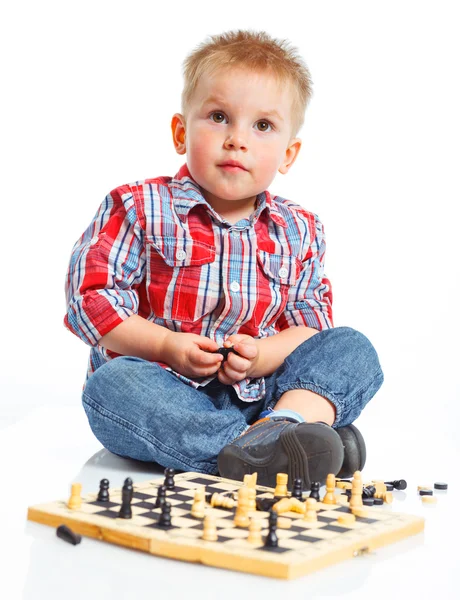 Little boy plays chess. — Stock Photo, Image