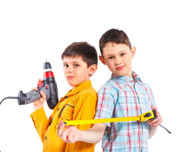 stock image Two cute boys with tape and a drill.