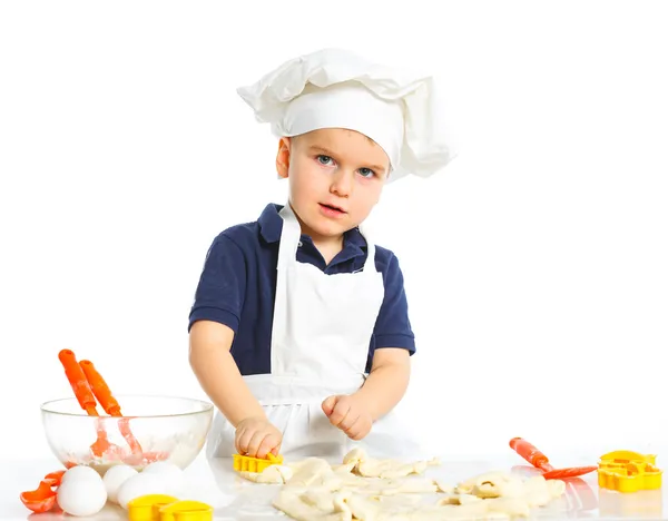 Beautiful caucasian boy making a cake — Stock Photo, Image