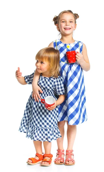 Dvě krásné mladé dívky s cup — Stock fotografie
