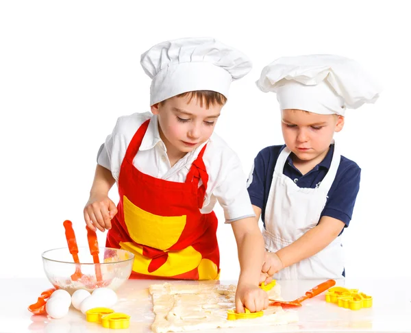 stock image Two beautiful caucasian brothers making a cake