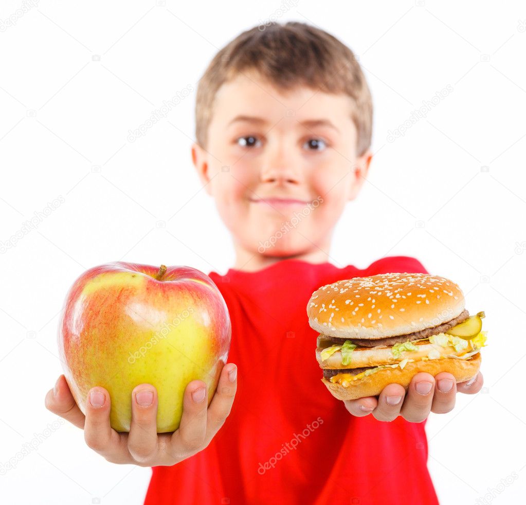Boy eating a hamburger.