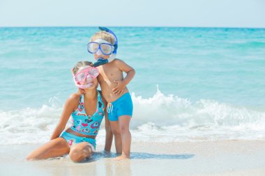 Happy Divers On A Beach clipart