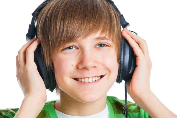 Portrait of a male teenager listening to music — Stock Photo, Image